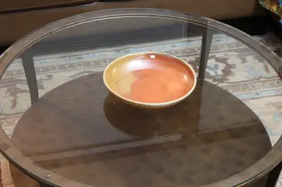 Flashed shallow bowl. Shallow bowl with an orange flashed interior.