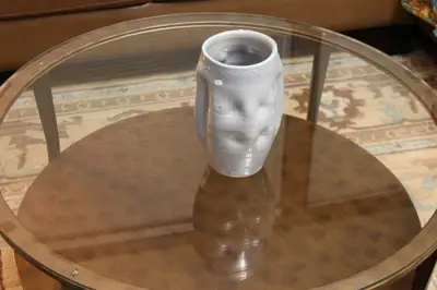 Altered white cup. White cup pushed out into soft facets.