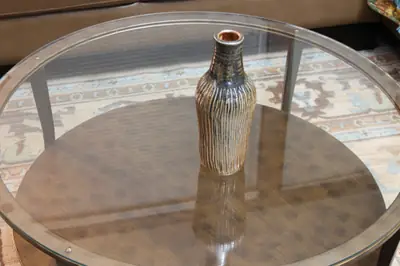 Fluted bottle. Narrow bottle with carved vertical flutes.