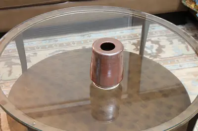 Brown cylinder. Small cylinder bottle in a deep red-brown glaze.