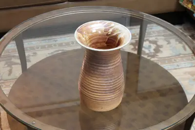 Flared vase. Ribbed vase with a wide flared mouth.