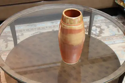 Flashed cylinder. Tall cylinder with orange and tan flashing.