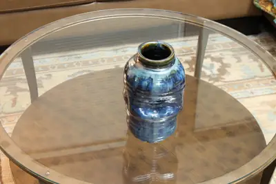Blue jar. Altered jar in a pooling blue glaze.