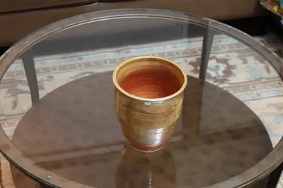 Orange-lined cup. Wide cup with a bright orange interior.
