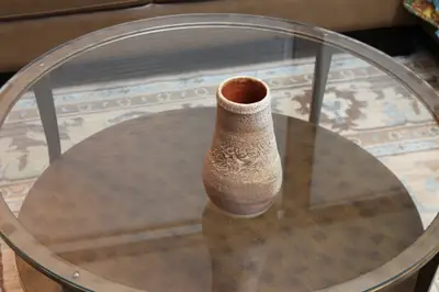 Textured series: small vase. Small textured vase with an orange interior.
