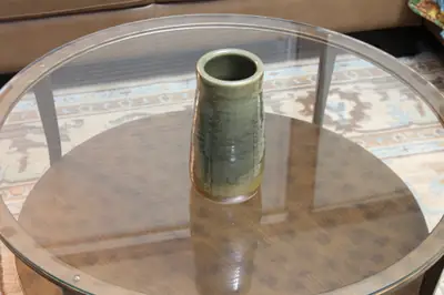 Green cylinder. Cylinder vase in a green glaze.