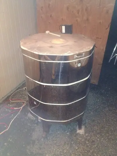 The updraft kiln. The propane kiln, banded with steel straps.