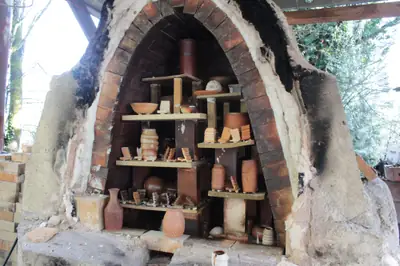 The soda kiln. Elinor’s soda kiln, loaded with ware behind its arch.