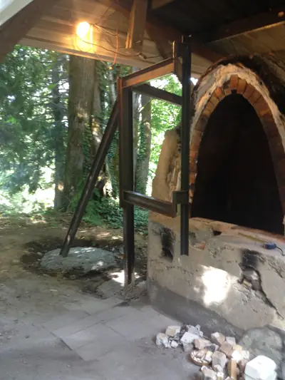 Door frame in place. The swing arm in position at the kiln door.