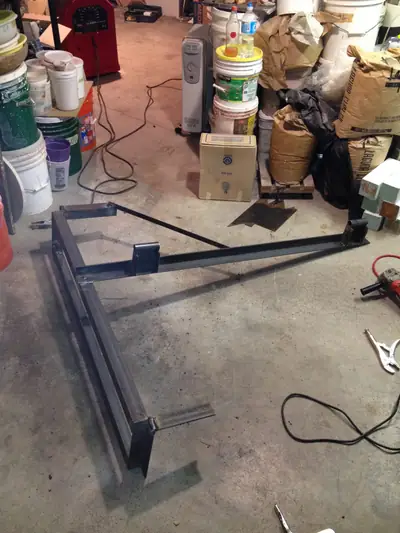 Door tray, assembled. The tray and arms assembled on the shop floor.