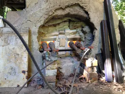 Burners lit. The burner ports glowing at the start of a firing.